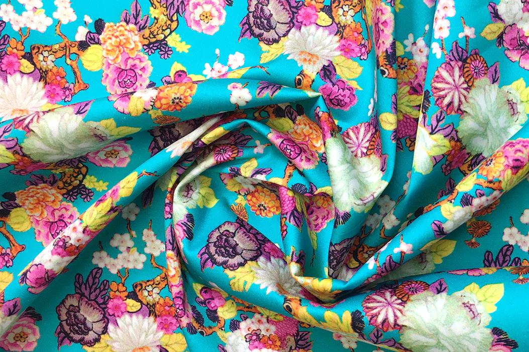 Baumwollstretch - Blüten auf türkis