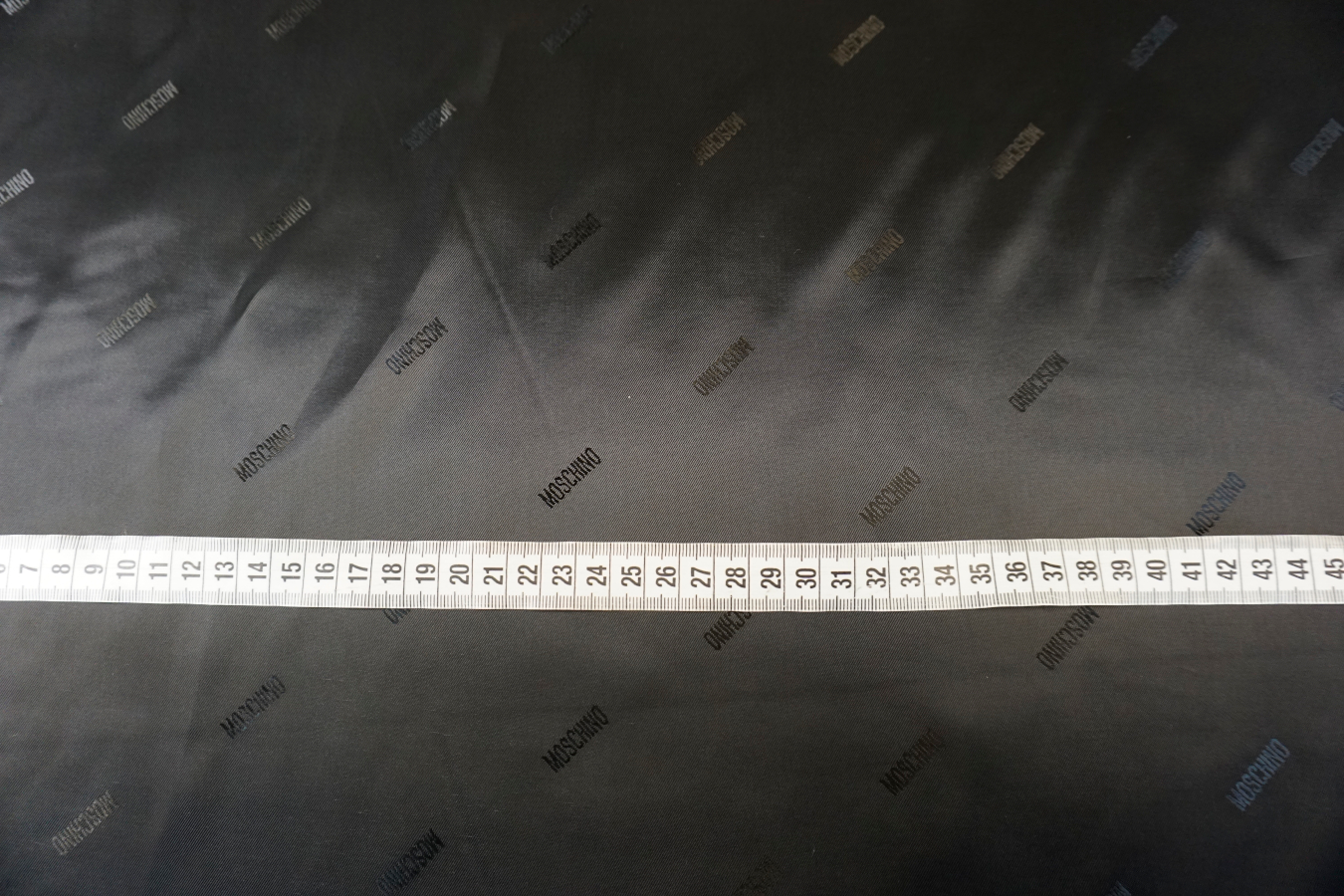 Futterjacquard - Schriftzug, schwarz